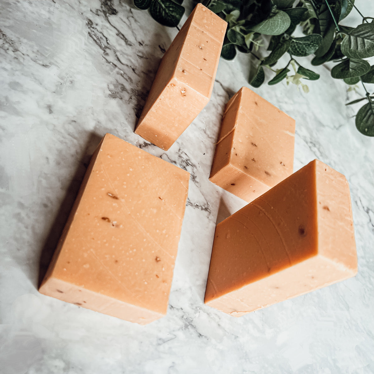 Handcrafted Honey, Orange & Turmeric soap bar with natural ingredients, showcasing its unique design and vibrant colors.