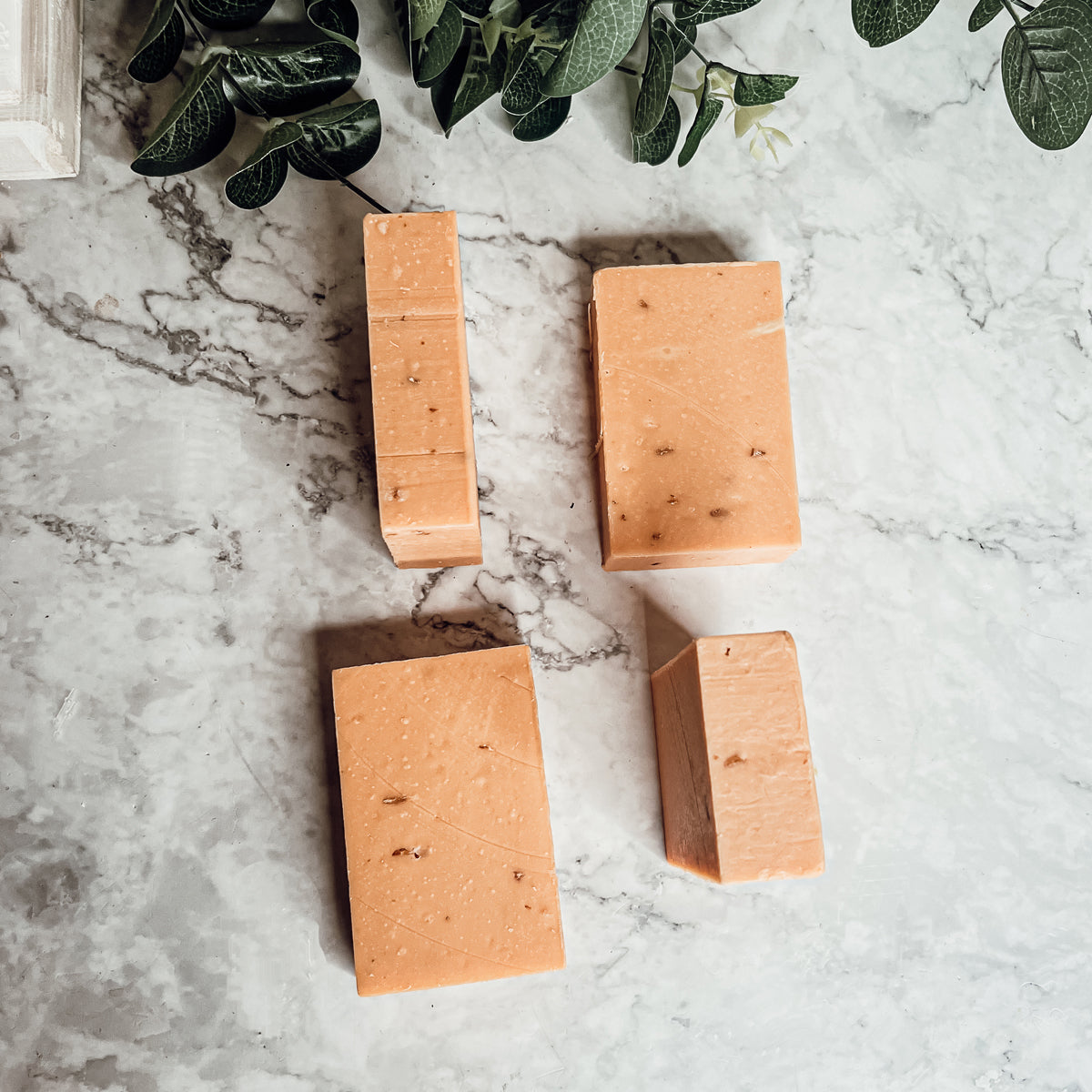 Handcrafted Honey, Orange & Turmeric soap bar with natural ingredients, showcasing its unique design and vibrant colors.