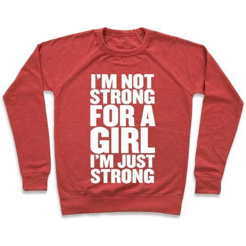 A stylish unisex crewneck sweatshirt featuring the phrase 'I'M NOT STRONG FOR A GIRL, I'M JUST STRONG' printed on the front, made from soft french terry fabric.