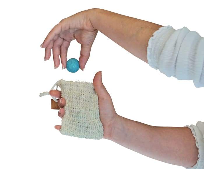 Joy Shower Smoothies 25 Pack featuring colorful essential oil-infused shower smoothies in a loofah bag.