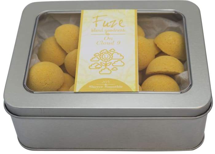 Joy Shower Smoothies 25 Pack featuring colorful essential oil-infused shower smoothies in a loofah bag.