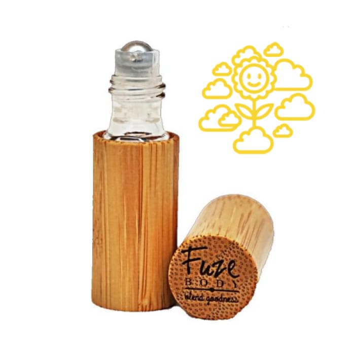 A roll-on bottle of Joy Wood Pure Essential Oils with a wooden cap, showcasing a vibrant citrus blend designed to uplift mood.