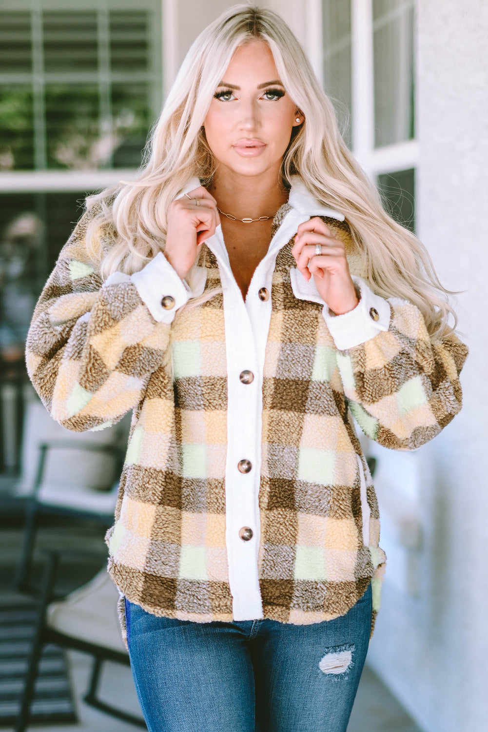Khaki plaid Sherpa shacket with flap pockets, showcasing a stylish winter layering piece.