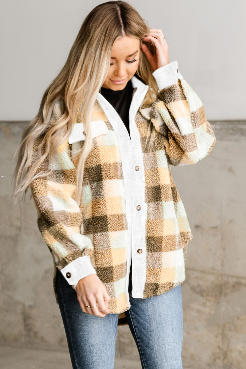Khaki plaid Sherpa shacket with flap pockets, showcasing a stylish winter layering piece.