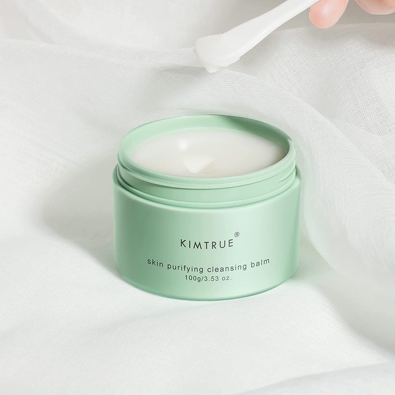 KIMTRUE skin purifying cleansing balm in a jar, showcasing its creamy texture and packaging design.