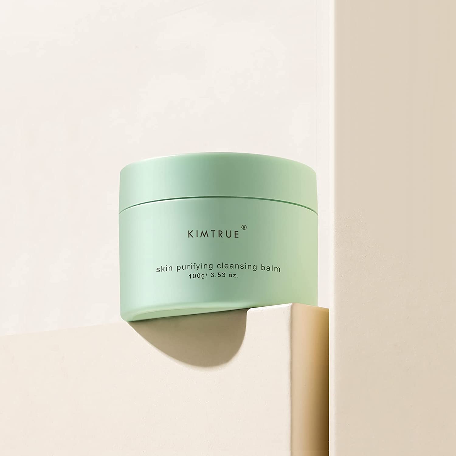 KIMTRUE skin purifying cleansing balm in a jar, showcasing its creamy texture and packaging design.