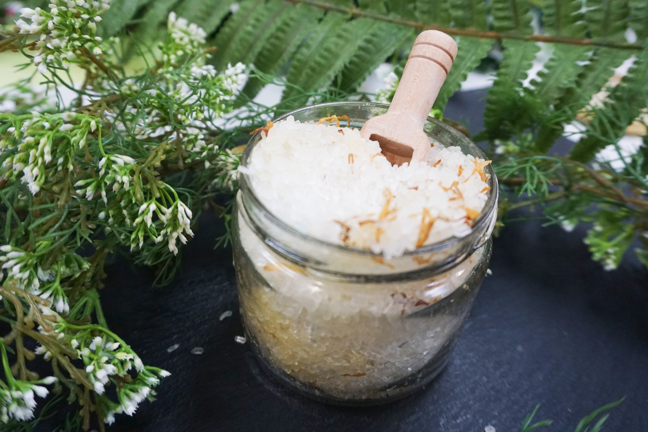 A beautifully packaged Lemon and Calendula Bath Soak featuring vibrant calendula petals and a refreshing lemon scent, perfect for a relaxing bath.