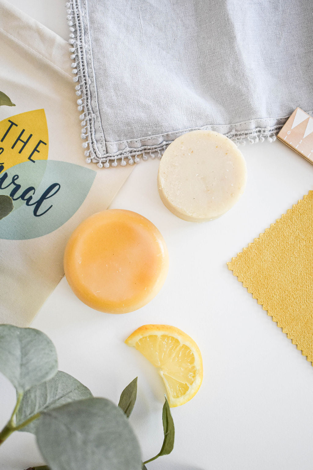 Lemon Shampoo and Conditioner Bar set featuring vibrant yellow bars with natural ingredients, perfect for eco-friendly hair care.