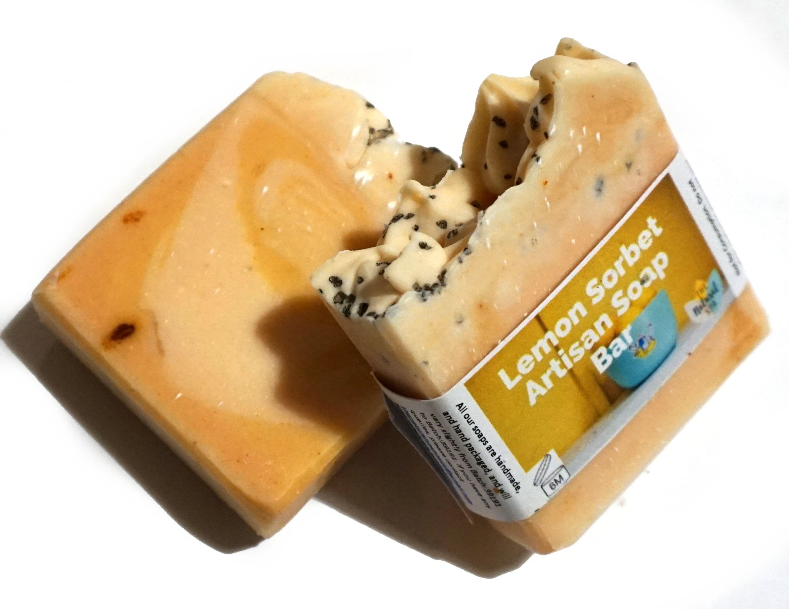 Lemon Sorbet Soap Bar featuring lemon, lemongrass, and poppy seeds, beautifully handcrafted with unique designs.