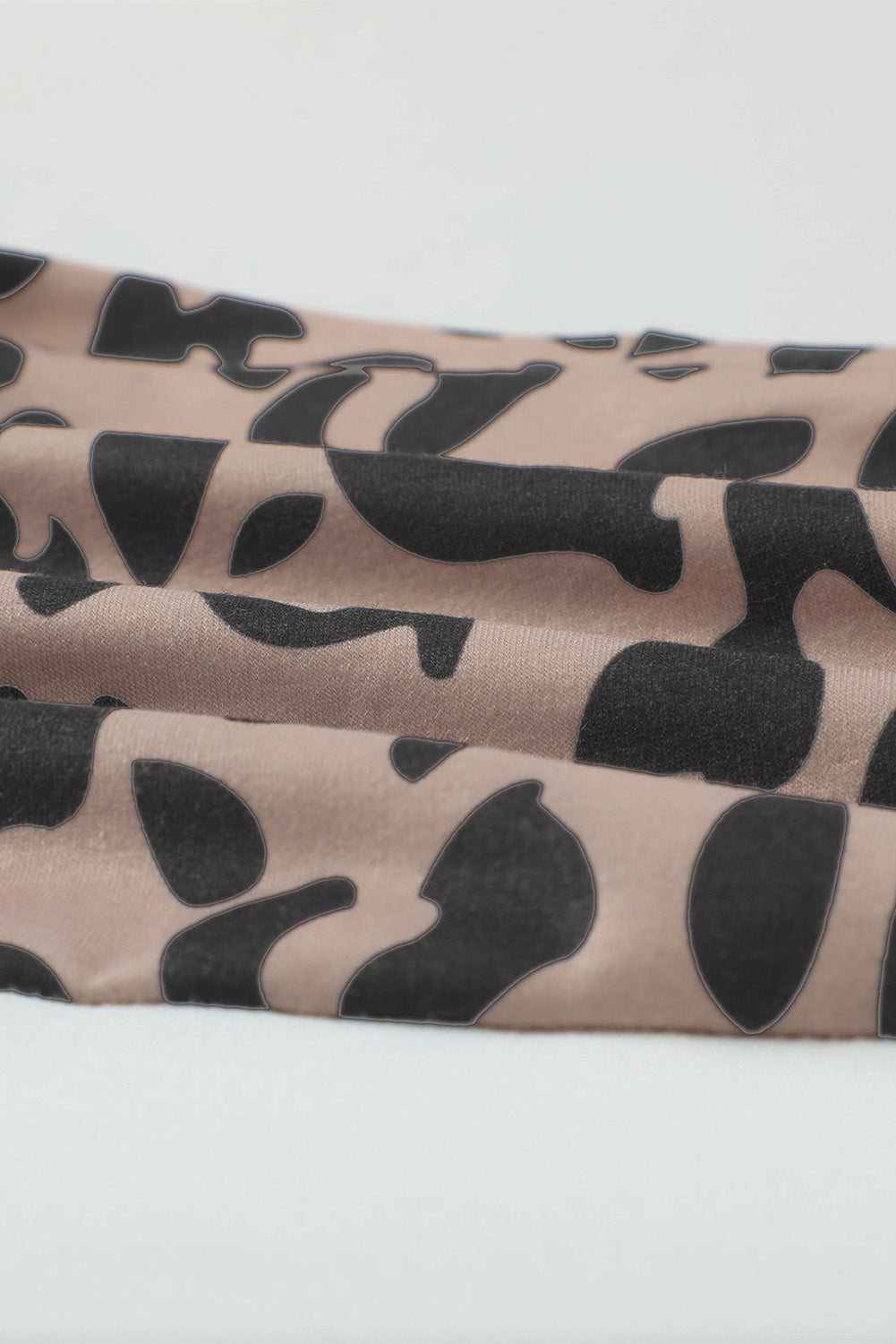 Leopard Block Cardigan with Pockets, featuring a stylish leopard print and color block design, perfect for casual wear.