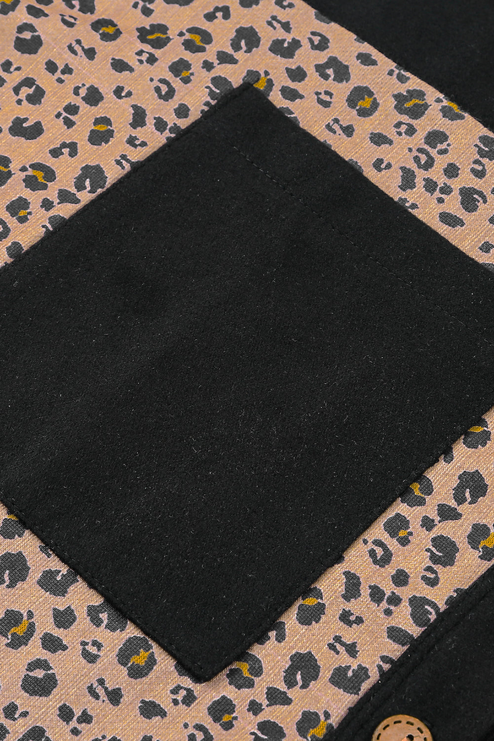 Leopard Patchwork Shacket Jacket featuring charcoal and brown leopard print with mustard accents, button-front closure, and oversized chest pockets.