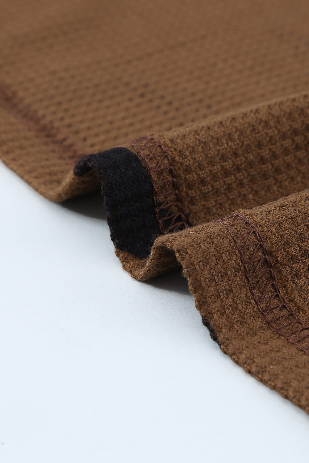 A stylish leopard print top featuring a side split design, V-neckline, and long sleeves, perfect for casual wear.