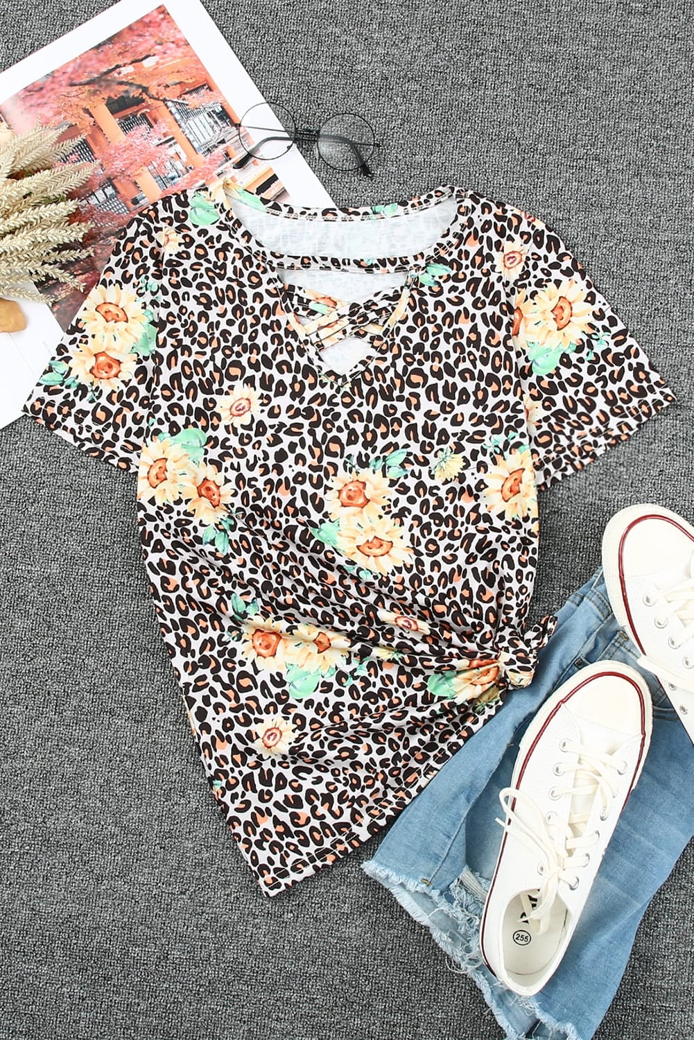 Leopard Sunflower Hollow Out Criss-cross Tee featuring a stylish leopard pattern and vibrant sunflower print, perfect for modern ladies.