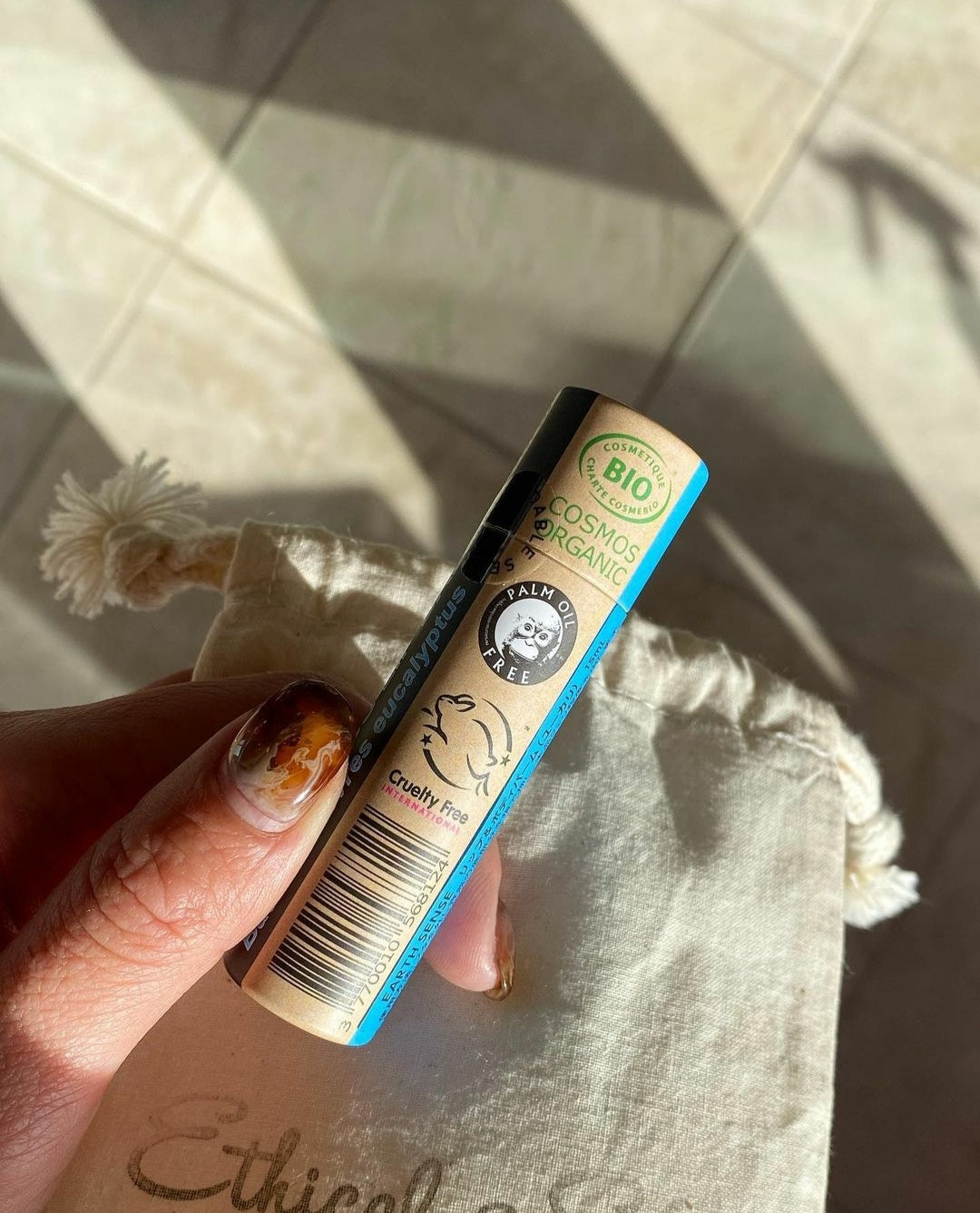 A collection of 30 x 15ml Organic Eucalyptus Lip Balms in eco-friendly packaging, showcasing their natural ingredients and refreshing scent.