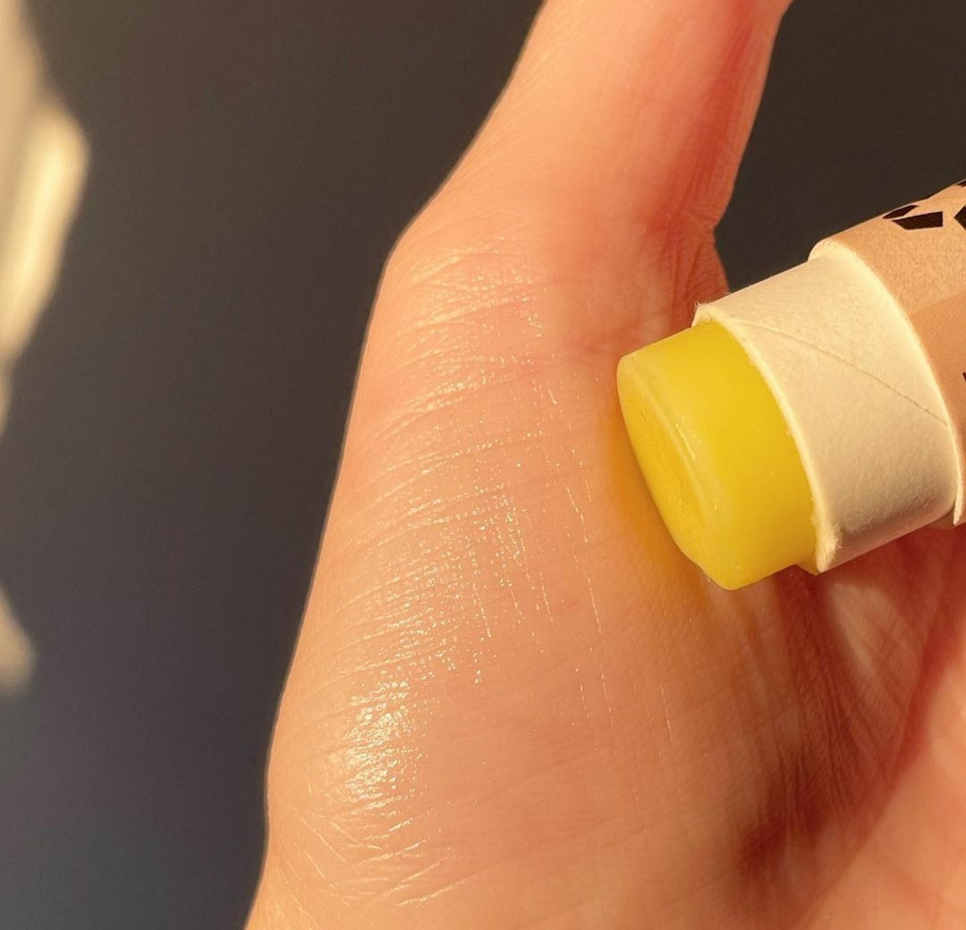 A collection of 30 x 15ml Organic Peppermint Lip Balms in eco-friendly packaging, showcasing their natural ingredients.