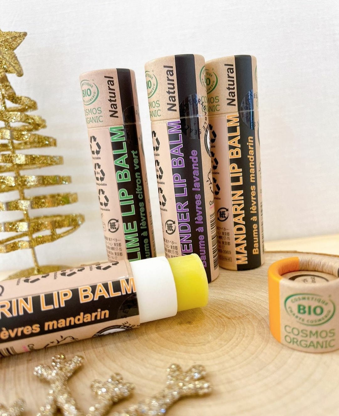 A collection of 30 x 15ml Organic Peppermint Lip Balms in eco-friendly packaging, showcasing their natural ingredients.
