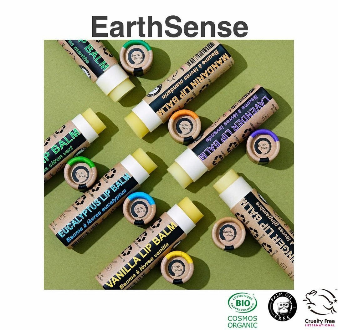 A collection of 30 x 15ml Organic Peppermint Lip Balms in eco-friendly packaging, showcasing their natural ingredients.