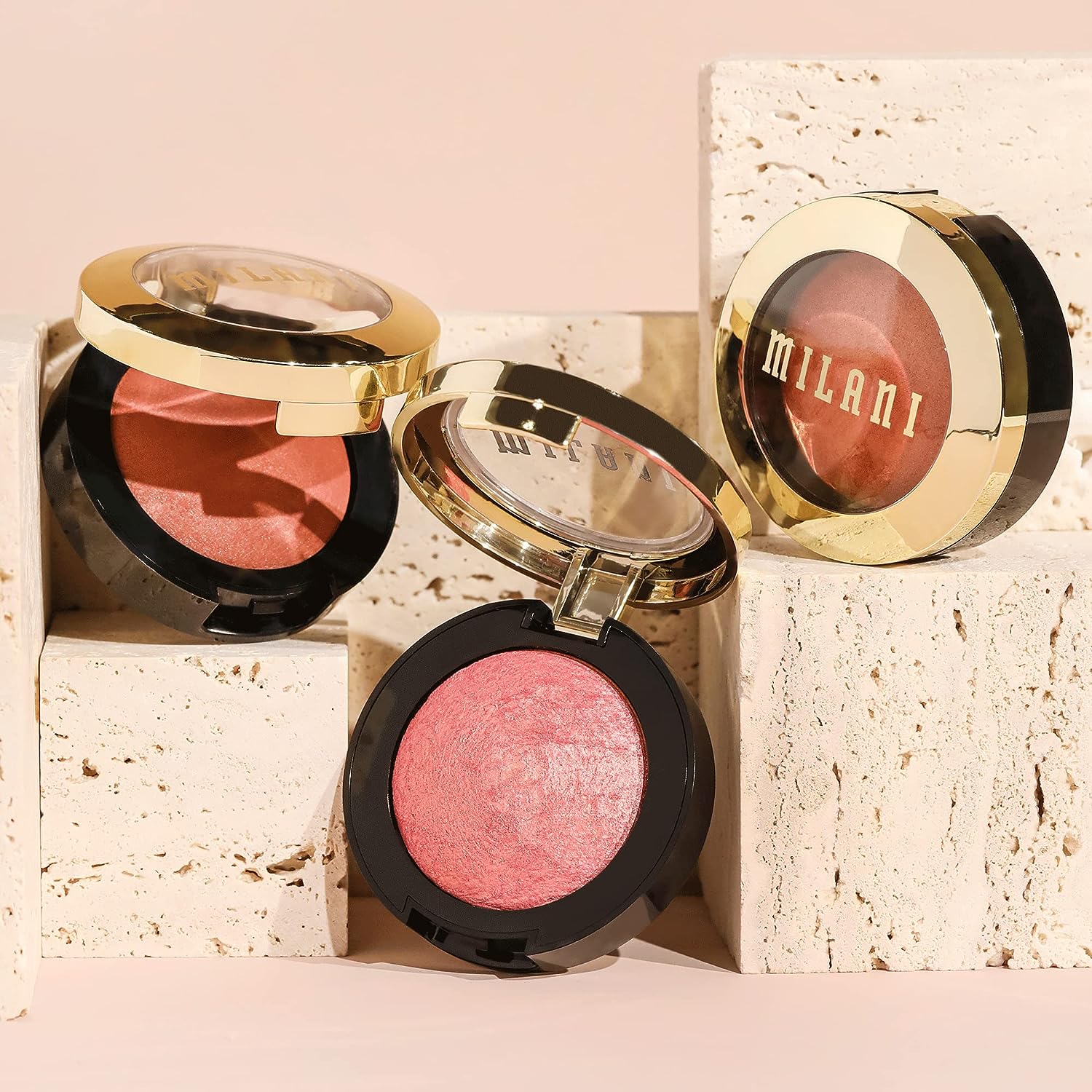 Milani Baked Blush in Dolce Pink, showcasing its vibrant color and shimmery finish in a compact.