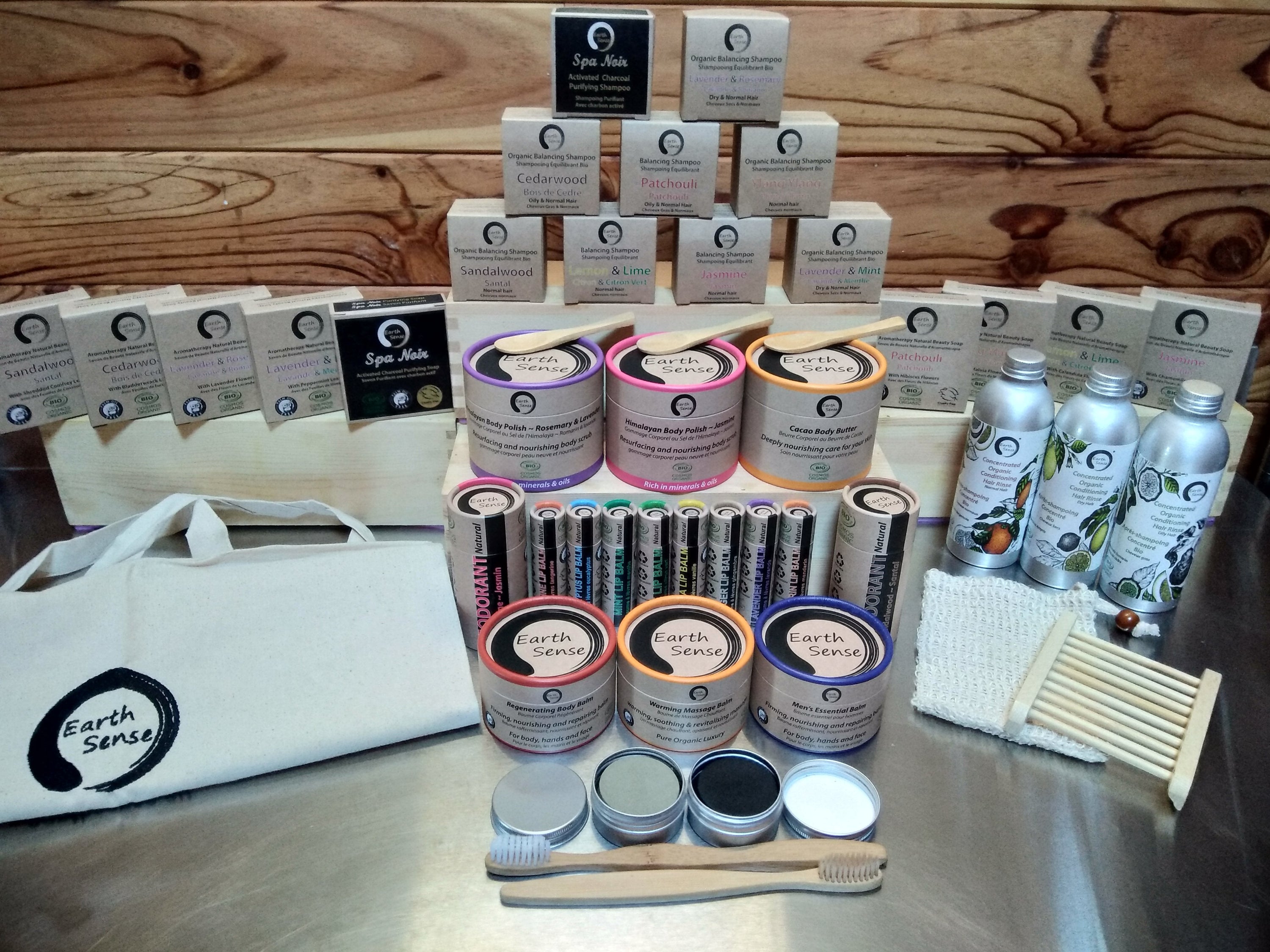 Four 90g bars of organic certified solid soap in sandalwood scent, featuring shredded comfrey leaves, beautifully packaged.