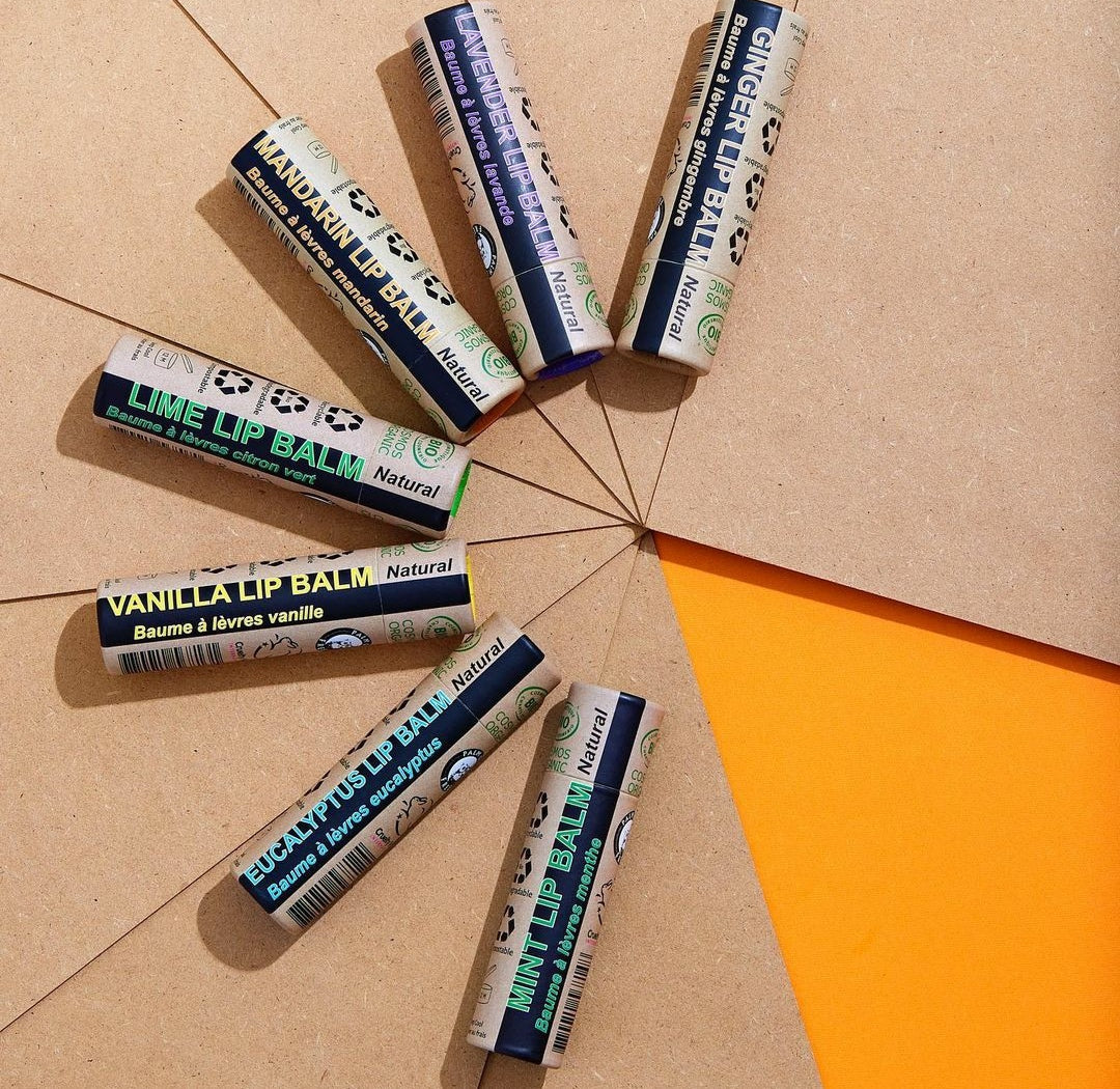 Four 15ml tubes of Organic Peppermint Lip Balm in eco-friendly packaging, showcasing their natural ingredients.