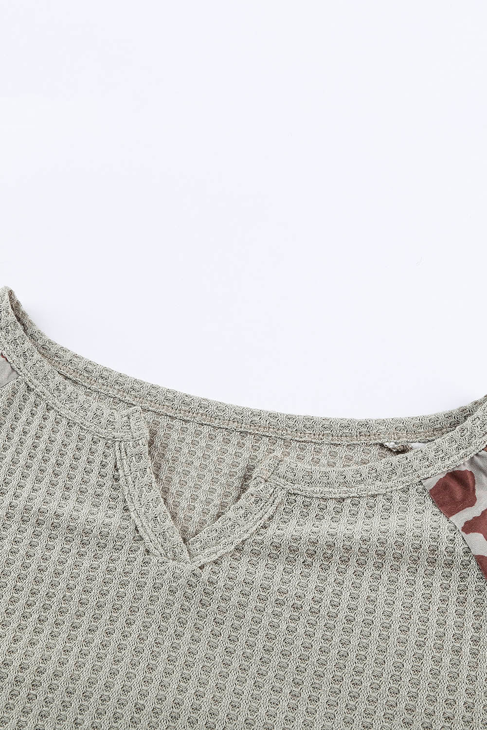 Mocha Leopard Print Waffle Knit Long Sleeve Top featuring a split neck and full-length sleeves with a stylish leopard print design.