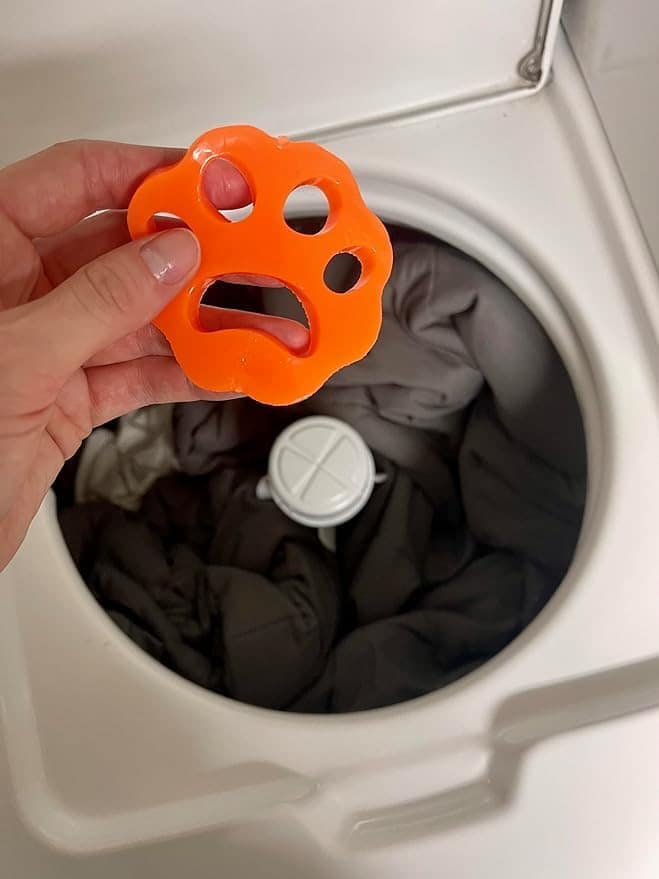 A pack of four Modern Pet Hair Removers designed for laundry, showcasing their reusable and eco-friendly features.