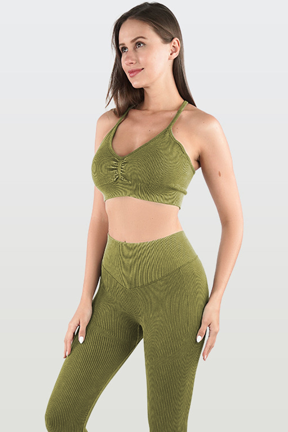 Moss Green Seamless Ribbed Spaghetti Straps Bra Leggings Sports Set showcasing a stylish and comfortable design, perfect for workouts.