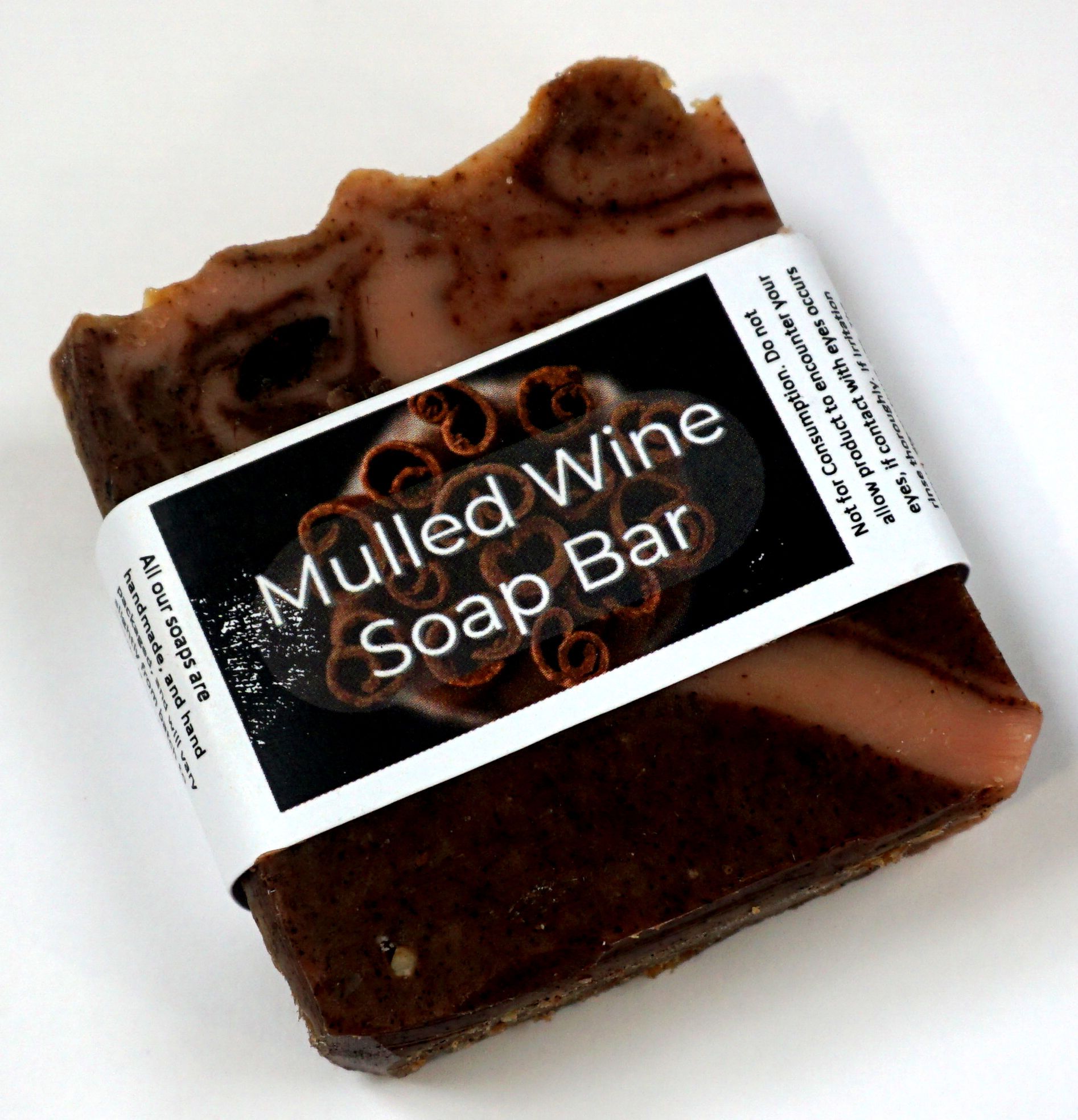 Mulled Wine Soap Bar featuring Juniper, Cinnamon, and Orange, beautifully hand-cut and swirled, showcasing its unique design and natural ingredients.