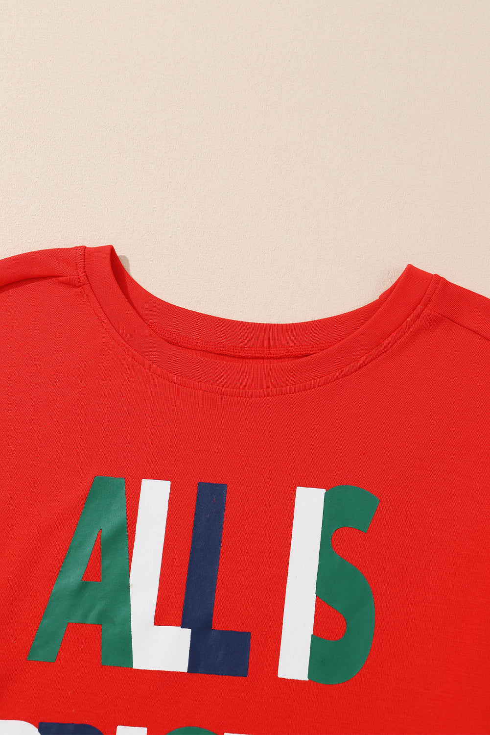 Multicolor ALL IS BRIGHT Graphic Christmas Plaid Pajamas Set featuring a red pullover with festive print and plaid jogger pants.