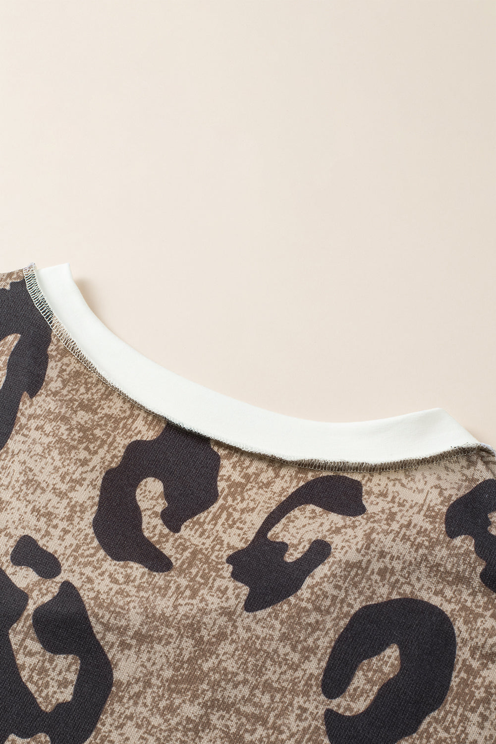 Multicolor Contrast V Neck Drop Shoulder Leopard Top featuring a trendy leopard print and stylish color block design.