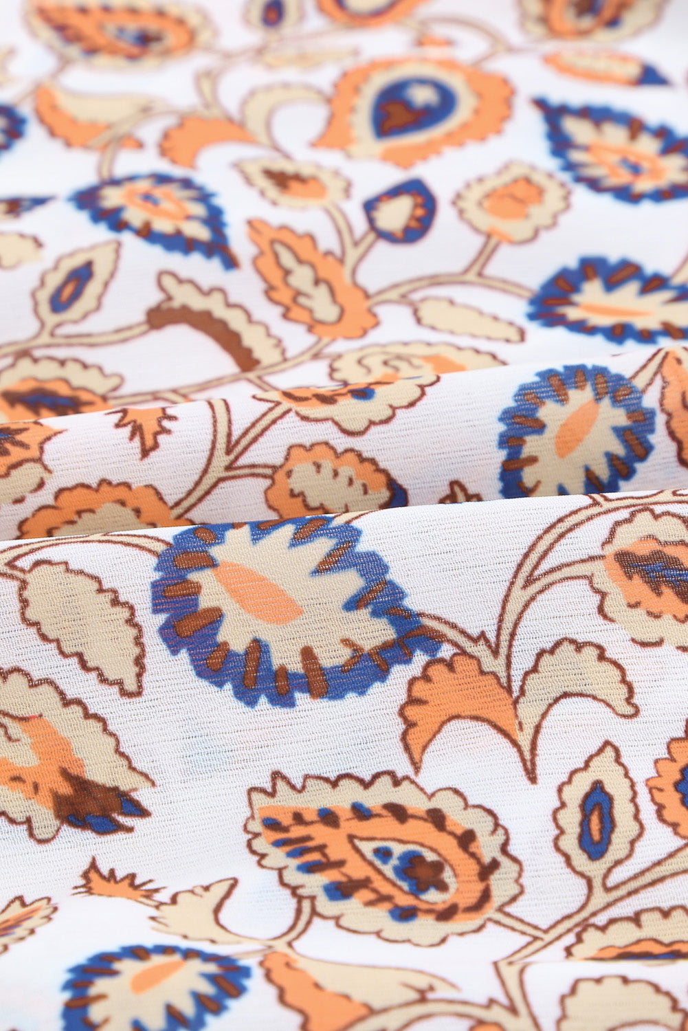 A vibrant multicolor loose fit floral striped blouse featuring a v-cut neckline, tie closure, and long flared sleeves, perfect for casual outings.