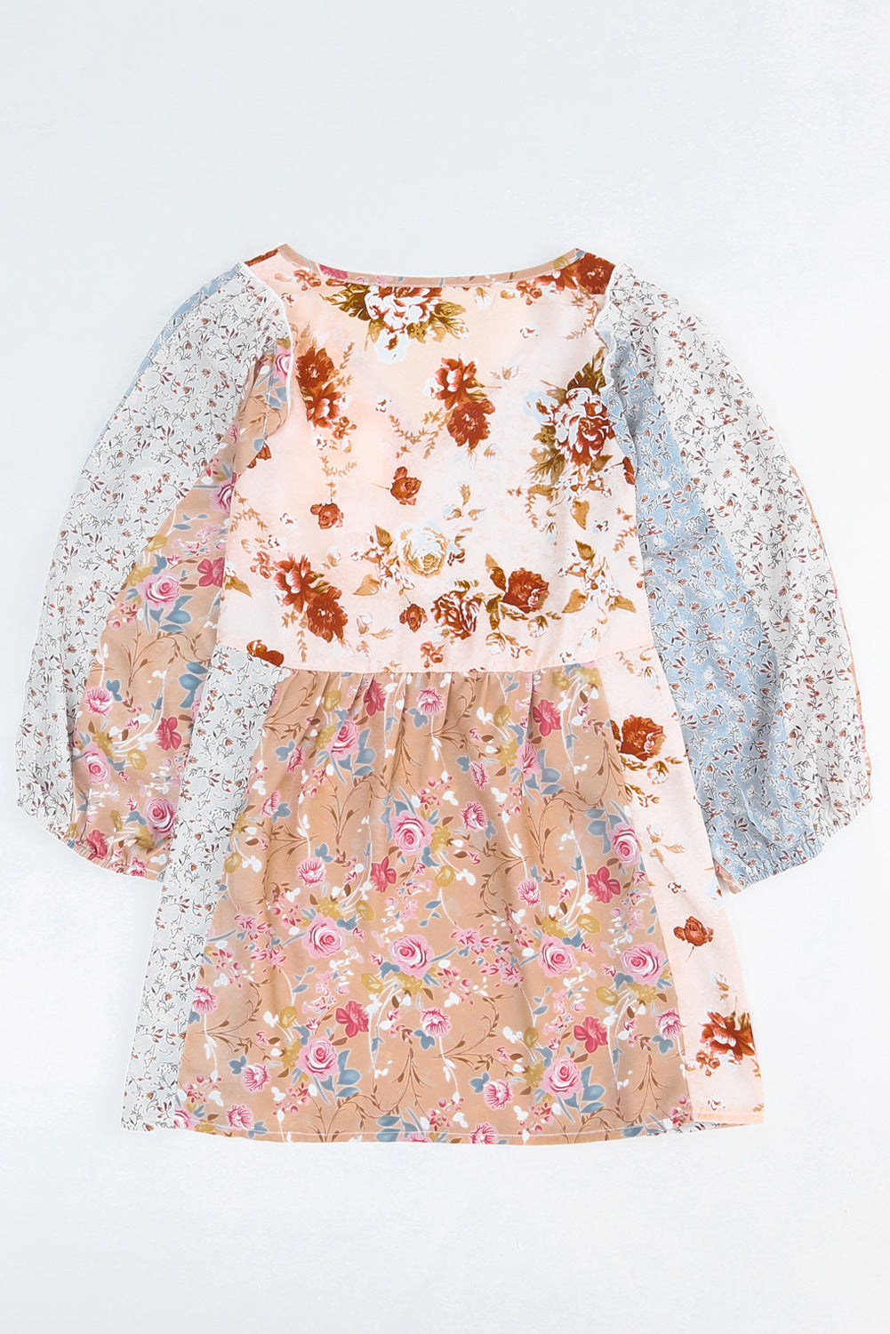 A stylish multicolor V neck babydoll top featuring a mixed floral print, perfect for casual wear.