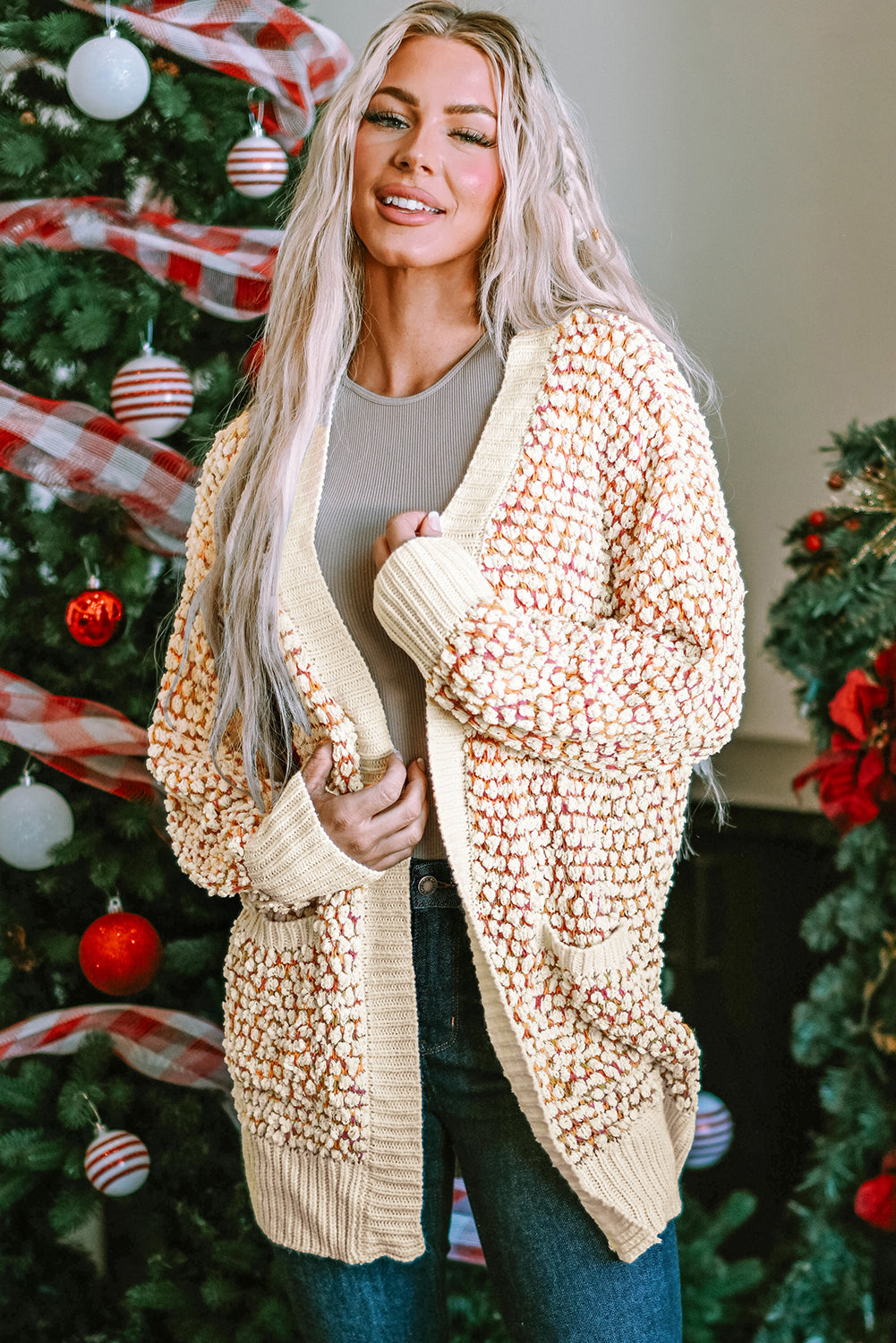 A stylish multicolour abstract printed cardigan with bishop sleeves, open front design, showcasing vibrant colors and cozy knitted fabric.