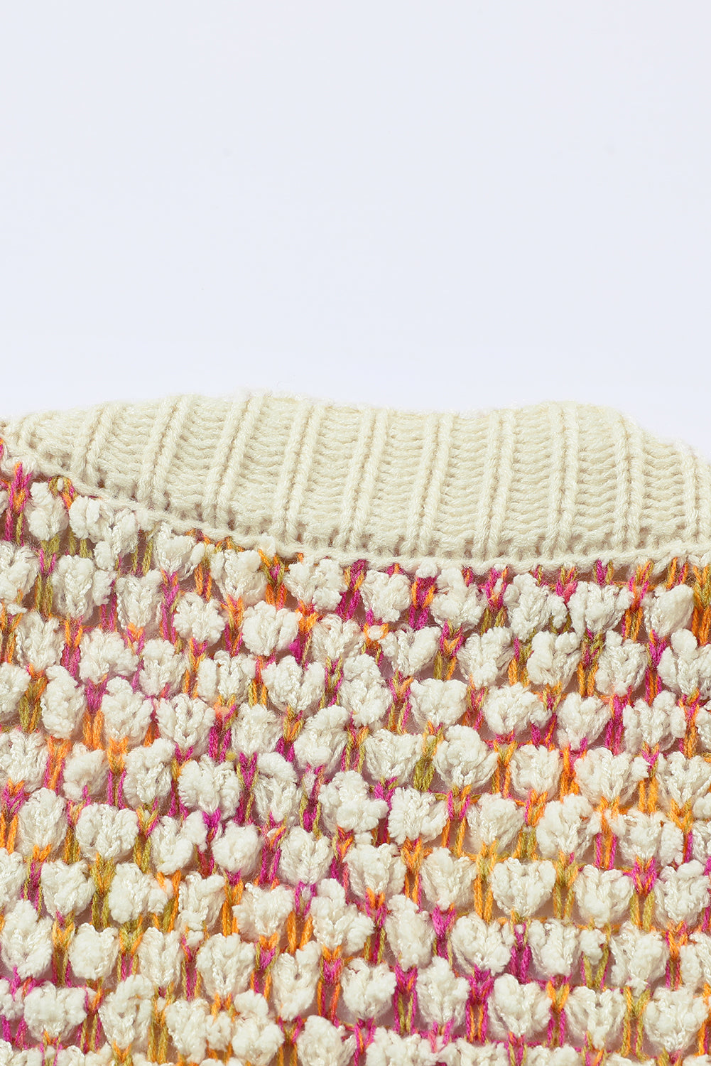 A stylish multicolour abstract printed cardigan with bishop sleeves, open front design, showcasing vibrant colors and cozy knitted fabric.