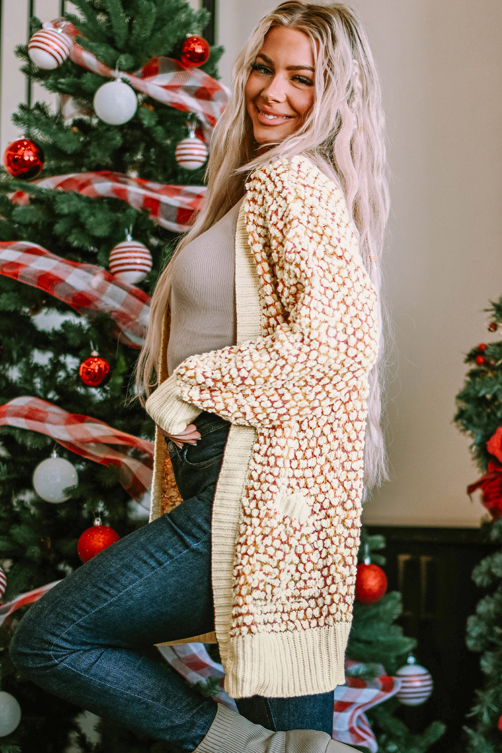 A stylish multicolour abstract printed cardigan with bishop sleeves, open front design, showcasing vibrant colors and cozy knitted fabric.