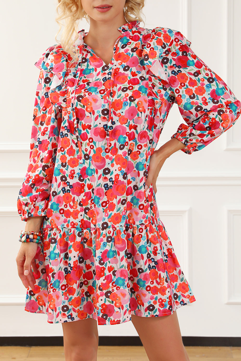A vibrant multicolour floral dress featuring a ruffle split neck, long sleeves, and a boho chic style, perfect for casual and semi-formal occasions.