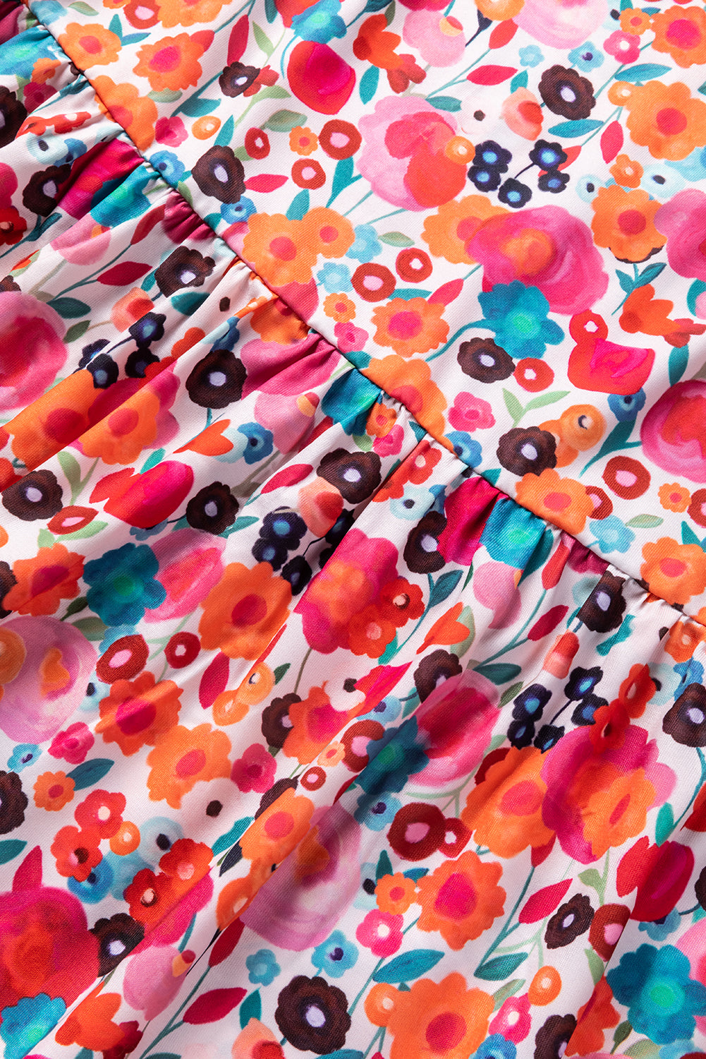 A vibrant multicolour floral dress featuring a ruffle split neck, long sleeves, and a boho chic style, perfect for casual and semi-formal occasions.