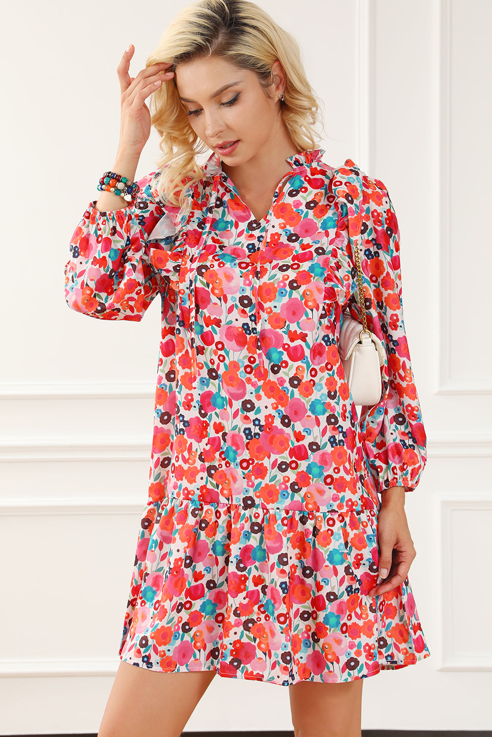 A vibrant multicolour floral dress featuring a ruffle split neck, long sleeves, and a boho chic style, perfect for casual and semi-formal occasions.