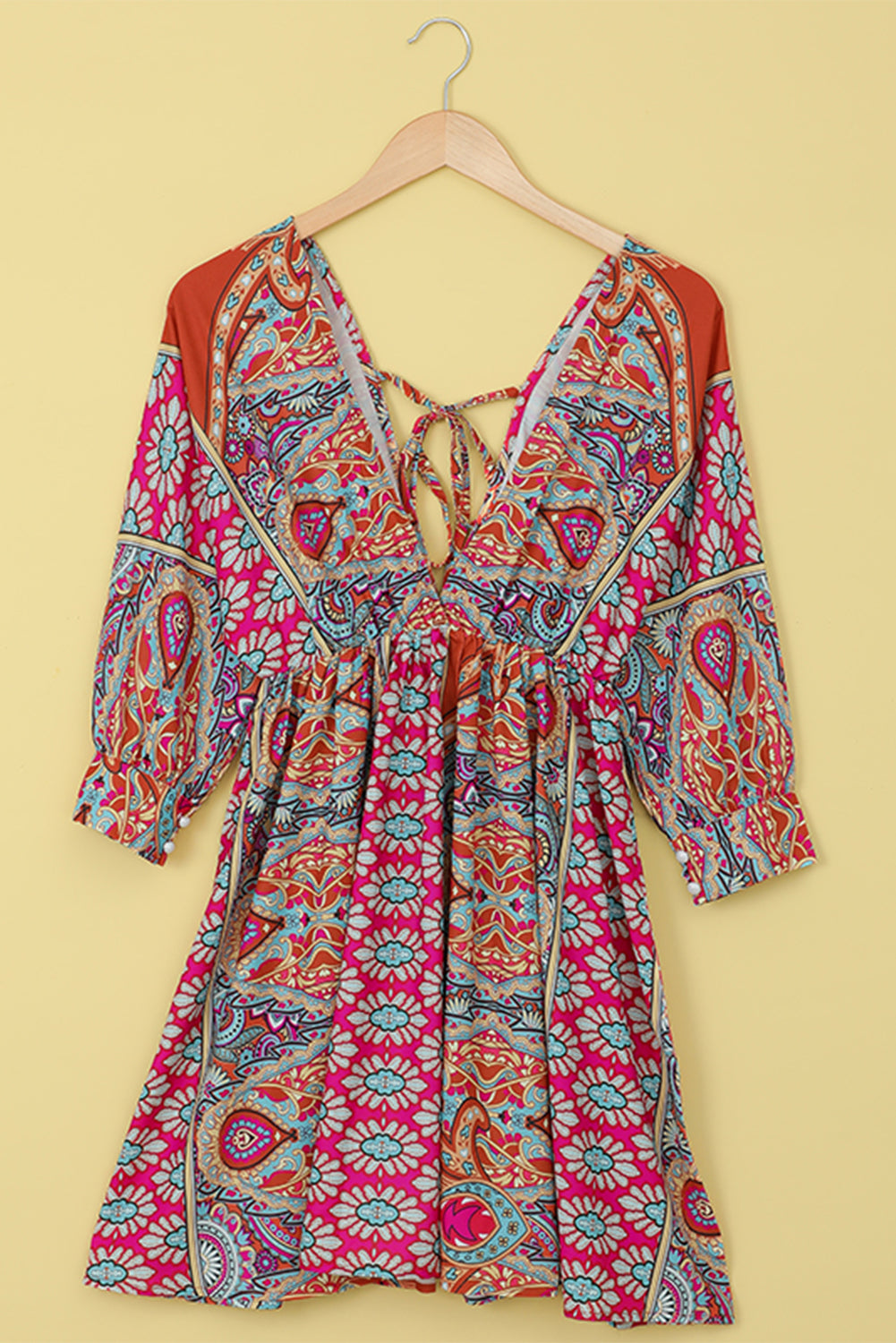 Multicolour V Neck 3/4 Sleeve Bohemian Vintage Print Mini Dress showcasing elegant open-back design and vibrant bohemian print.