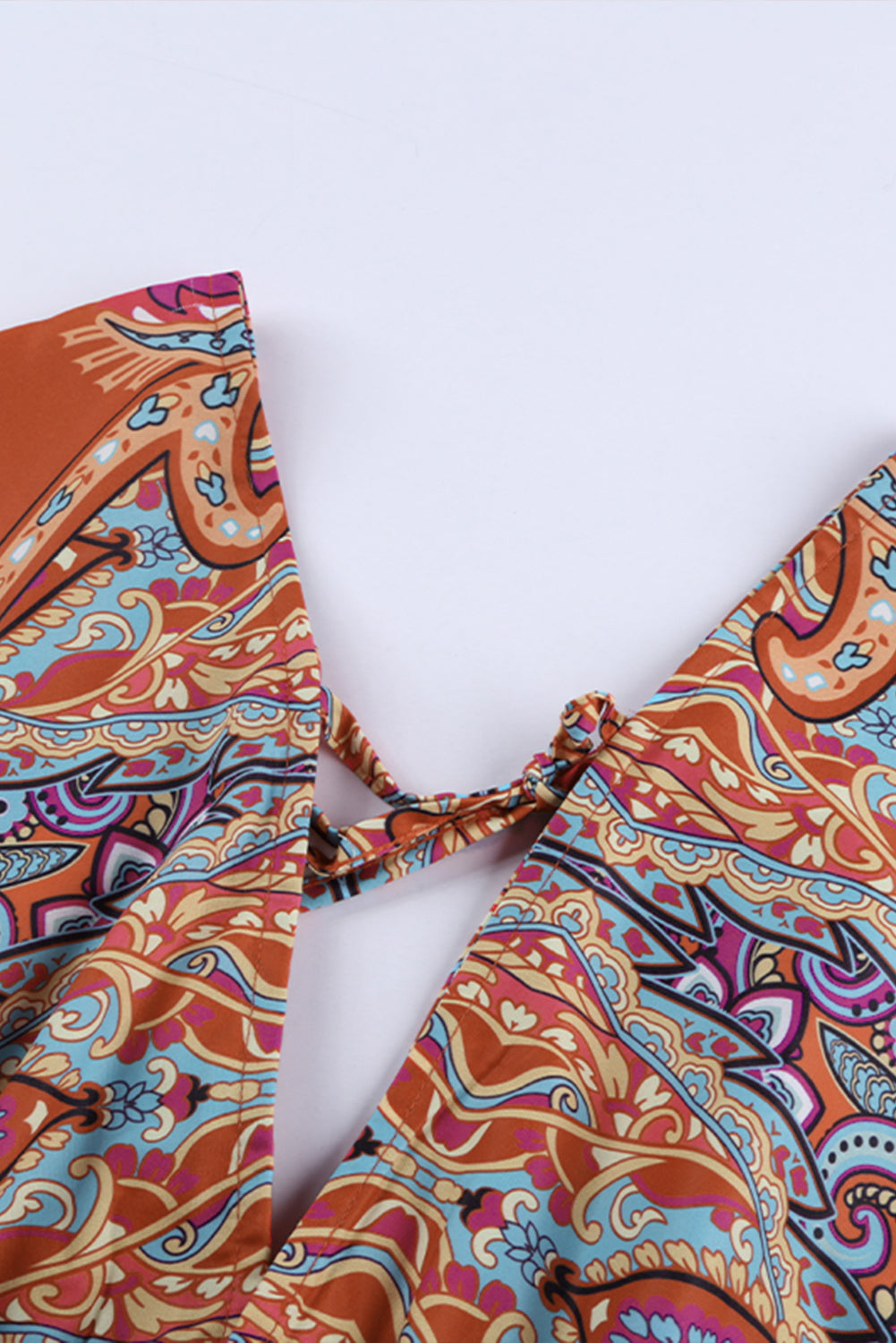 Multicolour V Neck 3/4 Sleeve Bohemian Vintage Print Mini Dress showcasing elegant open-back design and vibrant bohemian print.