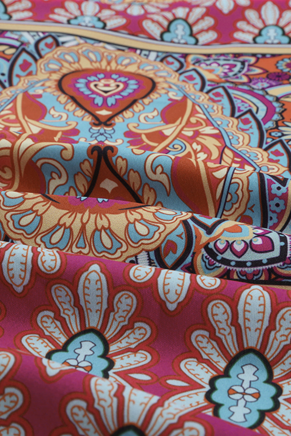 Multicolour V Neck 3/4 Sleeve Bohemian Vintage Print Mini Dress showcasing elegant open-back design and vibrant bohemian print.