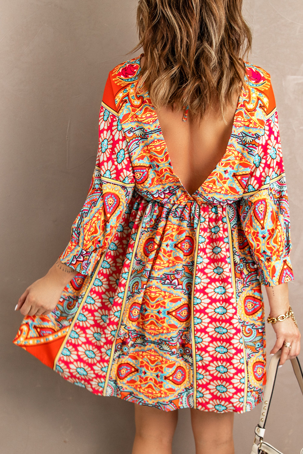 Multicolour V Neck 3/4 Sleeve Bohemian Vintage Print Mini Dress showcasing elegant open-back design and vibrant bohemian print.