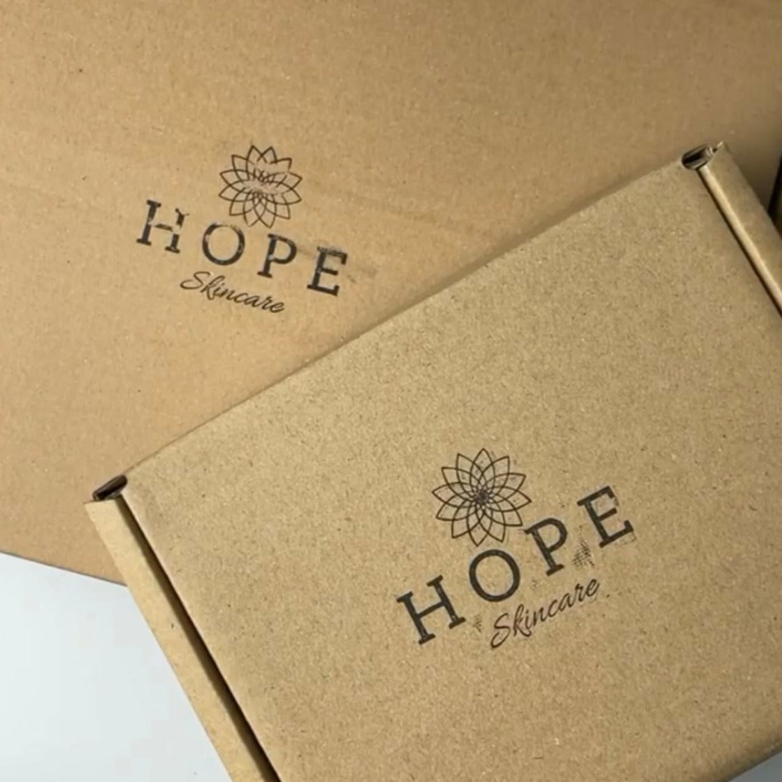 A colorful assortment of products in a mystery box, showcasing various natural items and sustainable packaging.