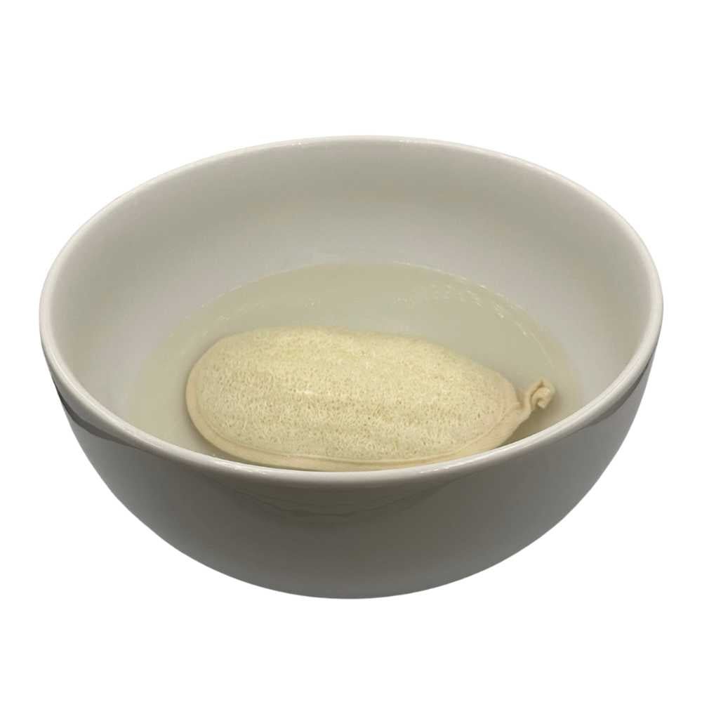 A natural loofah sponge made from organic loofah plant, showcasing its textured surface ideal for exfoliating skin.