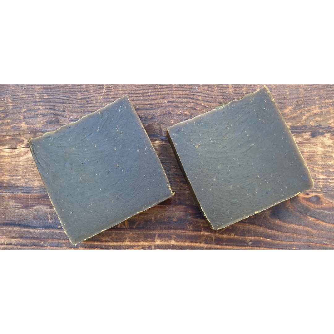 Handcrafted Neem & Tea Tree Soap with natural ingredients, showcasing its rich texture and vibrant color.