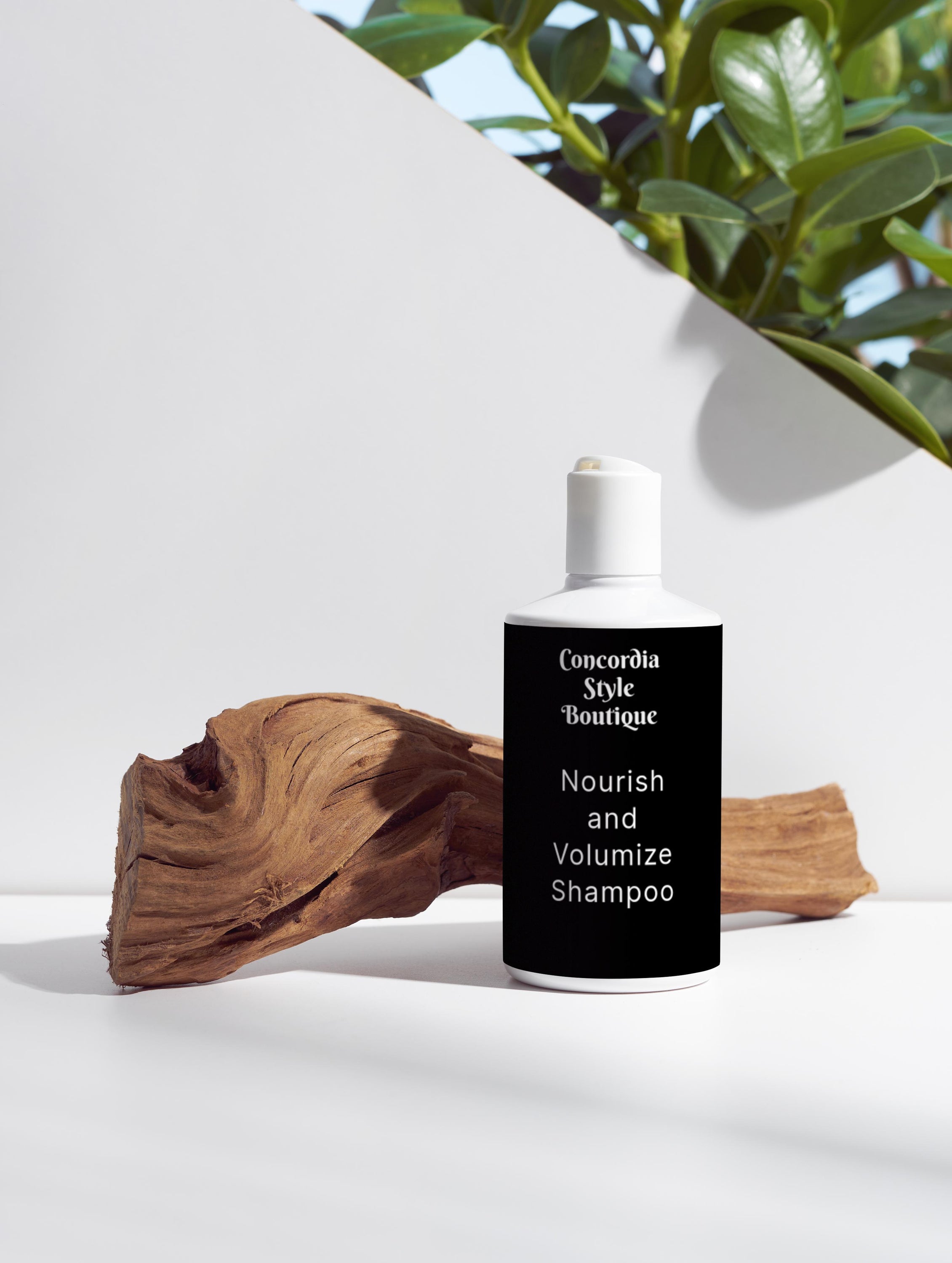 A bottle of Nourish and Volumize Shampoo with a sleek white design, showcasing its nourishing ingredients for healthy hair.