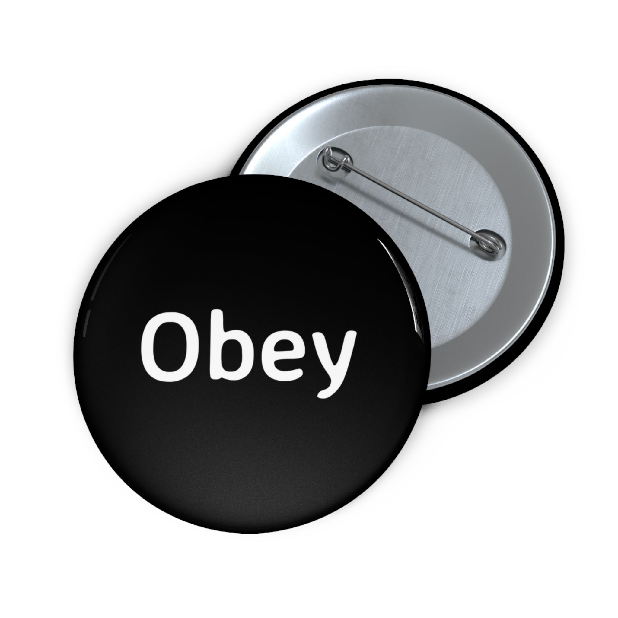 Obey Pin Button featuring a lightweight metal design with a strong safety pin backing, available in three sizes.