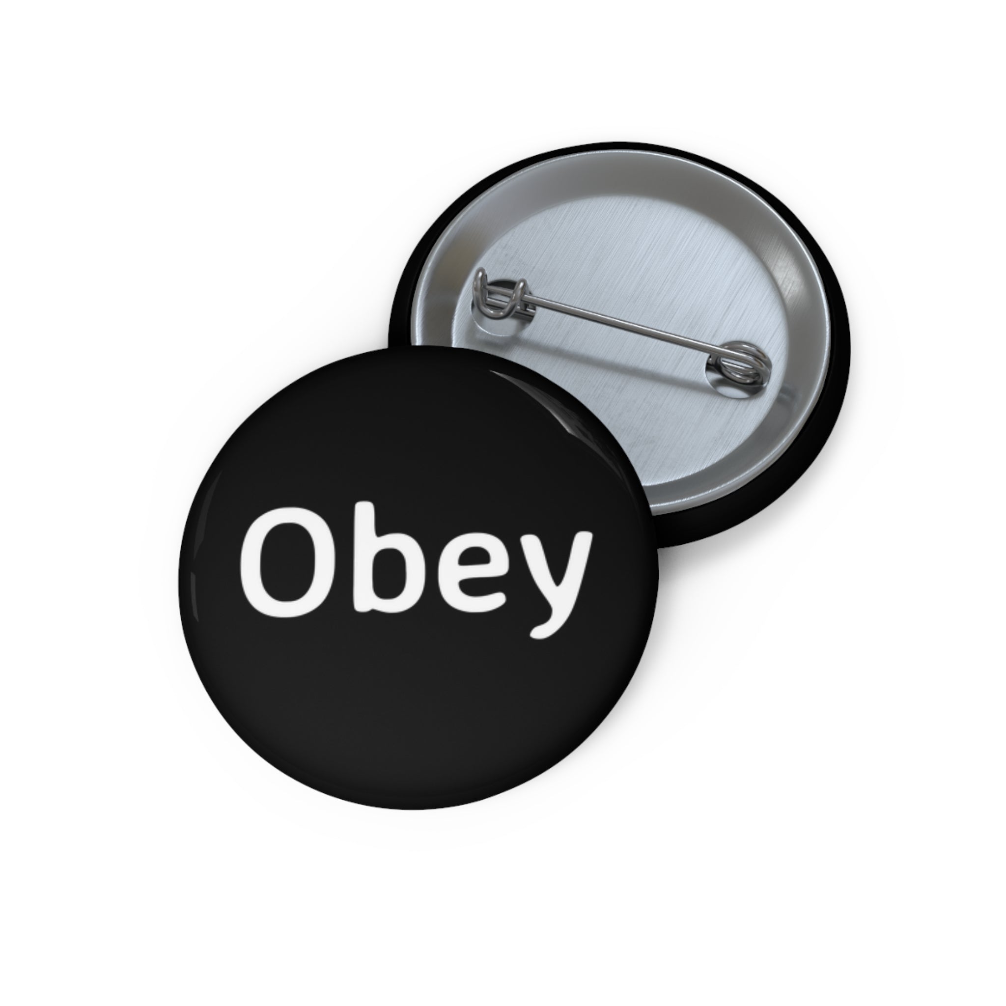 Obey Pin Button featuring a lightweight metal design with a strong safety pin backing, available in three sizes.