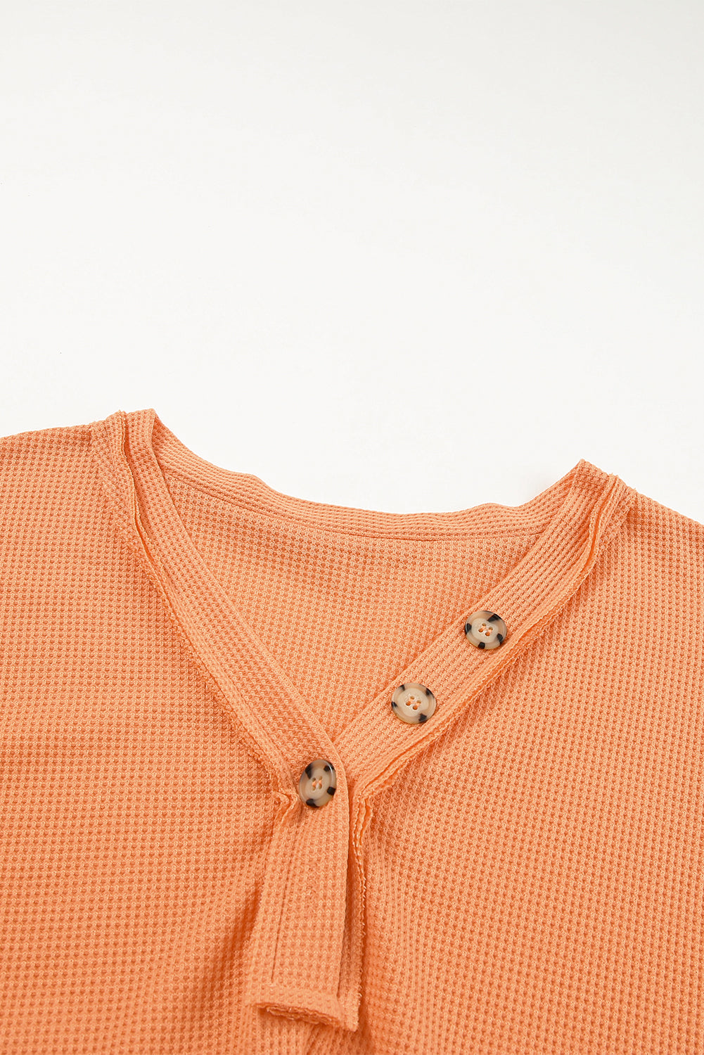 Orange Buttoned V Neck Waffle Knit Plus Size Top featuring a stylish waffle knit texture and buttoned neckline.