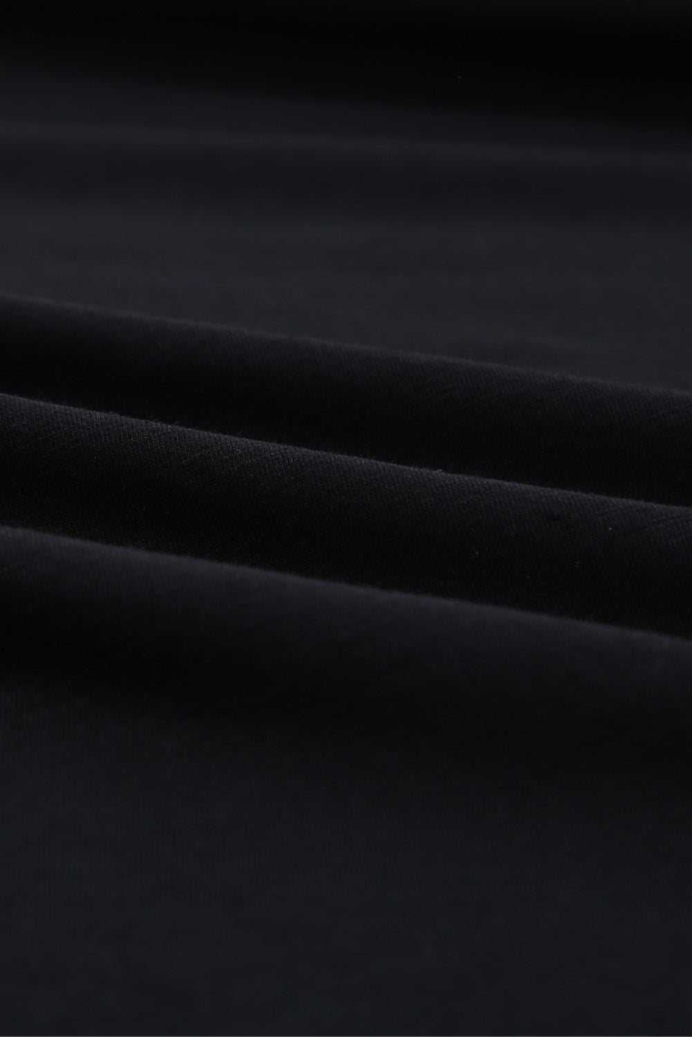 Orange crew neck t-shirt with unique holed design, short sleeves, and soft cotton fabric, perfect for casual wear.